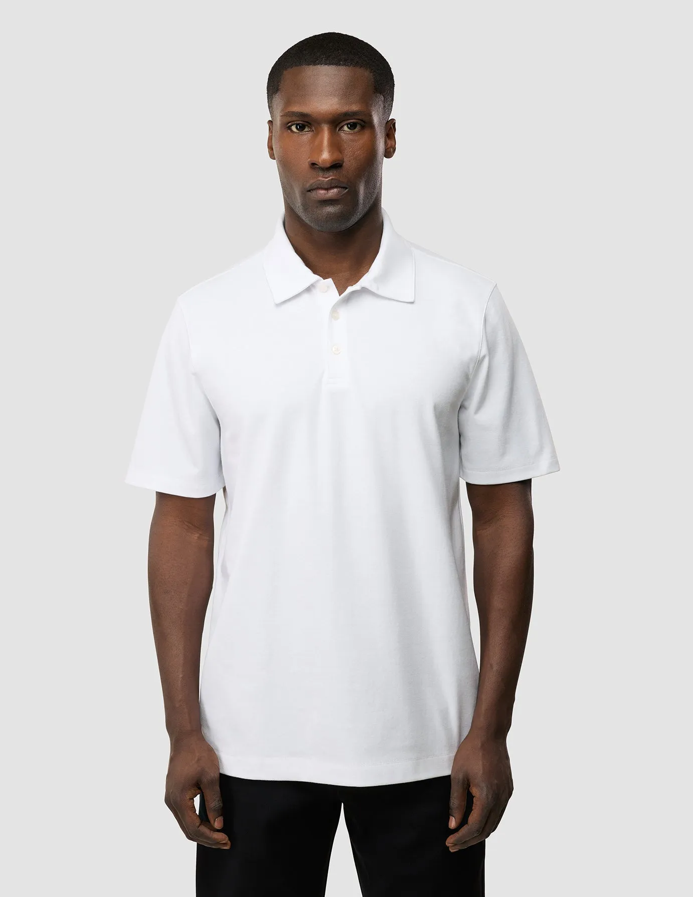Evolve Pique Polo White Stone Wash Process