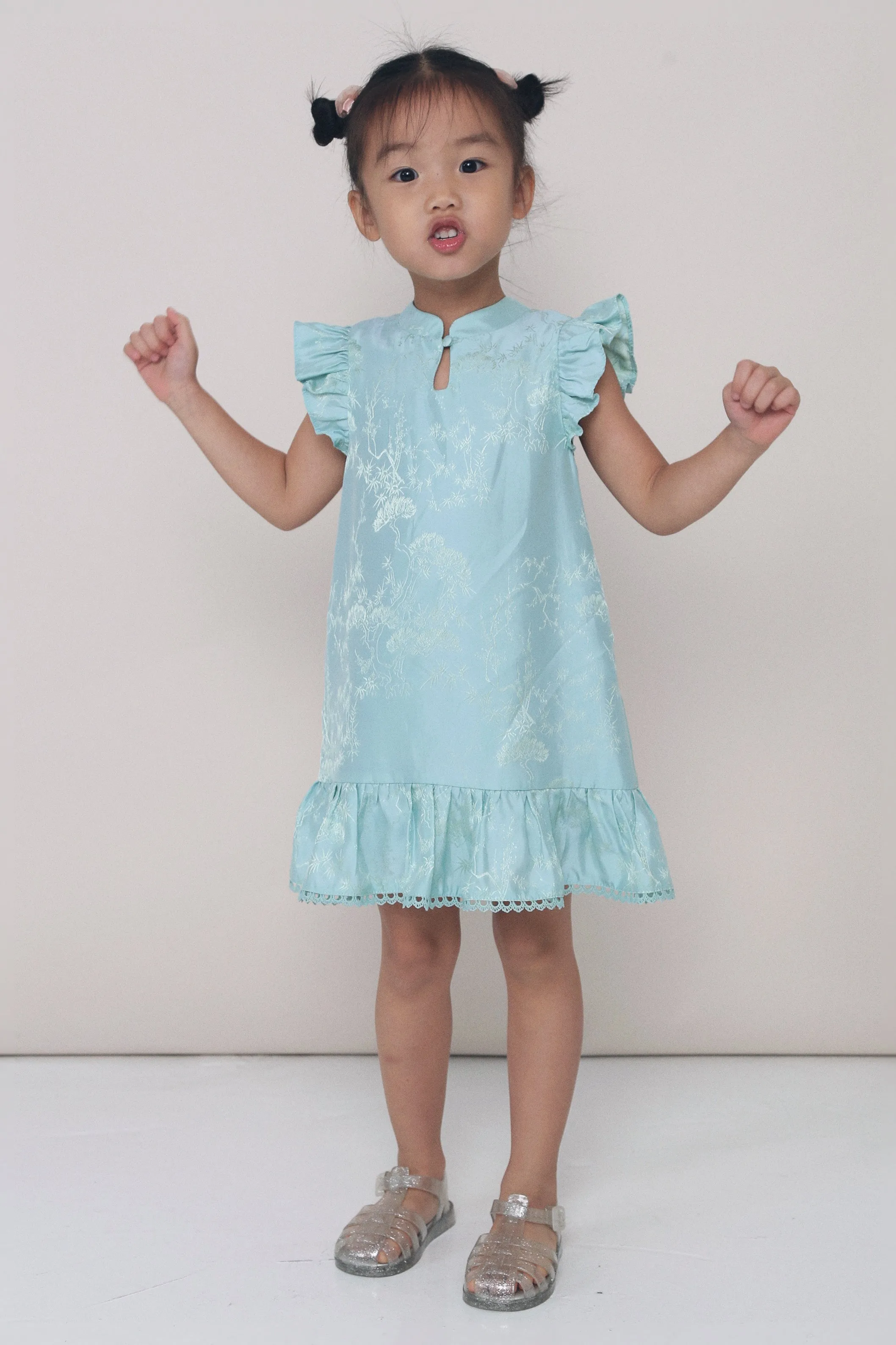 CNY MINI Evie Oriental Sleeveless Dress Sage Smart Lines Sculpted Form